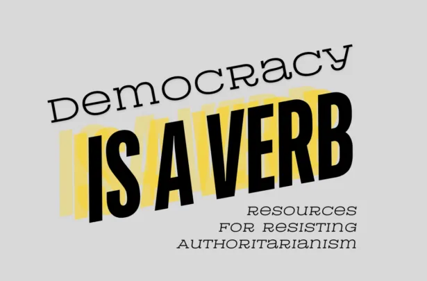 Khẩu hiệu 'Democracy is a verb' trên nền đa sắc kêu gọi hành động dân chủ